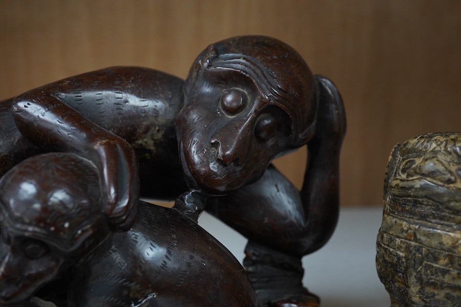 A Chinese carved soapstone ‘monkey’ group and another ‘lion dog’, monkey group 20cm x 14cm. Condition - fair to good